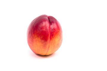 Ripe peach on a white background