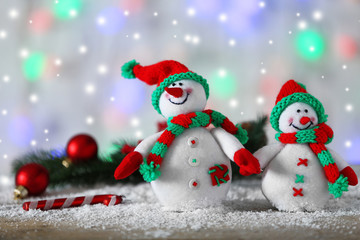 Cute snowmans on Christmas background