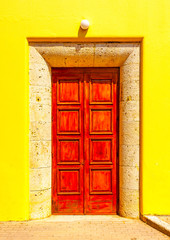 beautiful red wooden door from a building located at the center of Kos town at Kos island in Greece