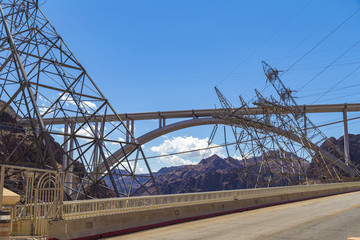 Bypass bridge seen through electricity pillars near Hoover Dam, USA