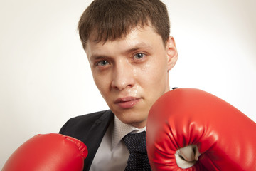 Businessman in red boxing gloves