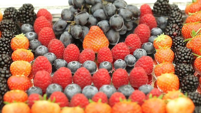 berries blackberries blueberries strawberries on a tray festive table