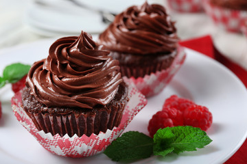 Chocolate cupcakes on plate closeup