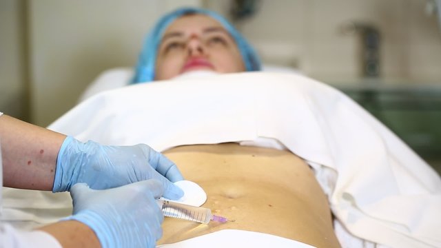 woman is in the process cellulite mesotherapy clinic
