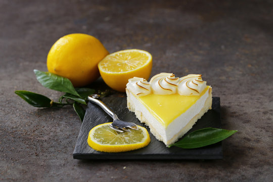 homemade baked lemon tart cake with meringue cream