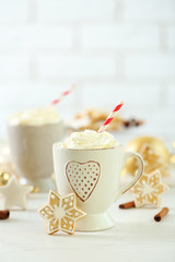 Beautiful composition with cups of cappuccino and Christmas cookies