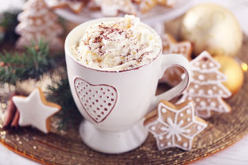 Beautiful composition with cup of cappuccino and Christmas cookies