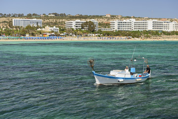 May 30, 2014: Photo of boat with people on the coast of Cyprus