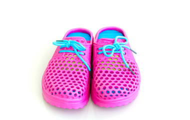 Colorful of pink rubber sandals on a white background