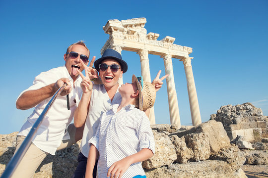 Funny family take a selfie photo on Apollo Temple colonnade view