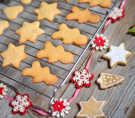 Closeup of Christmas cookies on wooden table with ornaments