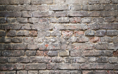 Old dark brick wall, closeup background texture