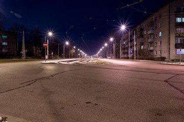 View of the city at night with tram tracks