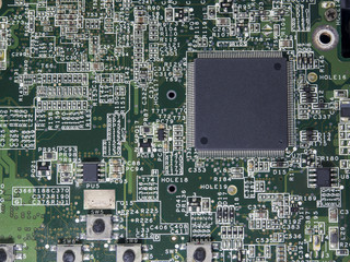 Closeup of electronic circuit board with processor,fixing comput