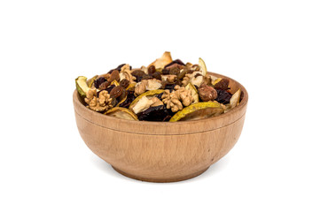 Wooden bowl with dried fruits and nuts isolated on white backgro