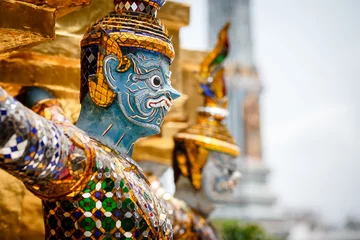 Foto op Aluminium Demons guarding Golden Stupa at Wat Phra Kaeo in the Grand palace, Bangkok, Thailand © PirahaPhotos