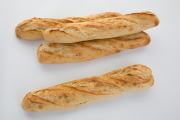 Four Baguette bread  in a row isolated on white background