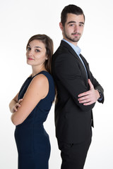 Sucessful business team with arms crossed leaning back to back