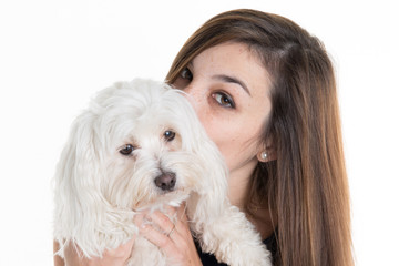 beautiful brunette woman with her dog, studio shot. isolated