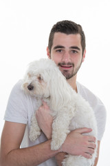 young casual man full body with a small dog