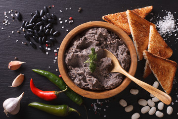 Mexican cuisine: pate of black beans close-up. horizontal top view
