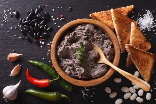 Mexican cuisine: pate of black beans close-up. horizontal top view
