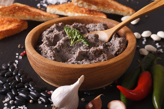 Frijoles refritos with ingredients close-up. Horizontal
