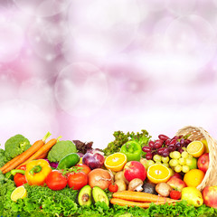 Vegetables and fruits over green background.