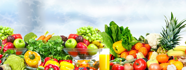Obraz na płótnie Canvas Vegetables and fruits over green background.