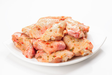 raw chicken wings on plate