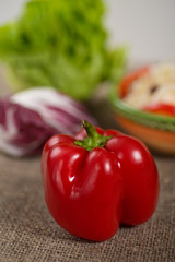 Red Pepper on Rustic Background