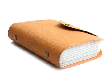 enclosed business card holder, back cover made of natural material, lies on a white isolated background