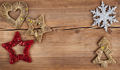 Christmas background. Snowflakes border on grunge wooden board.