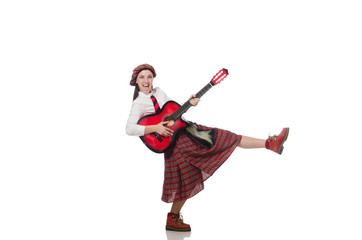 Woman in scottish clothing with guitar