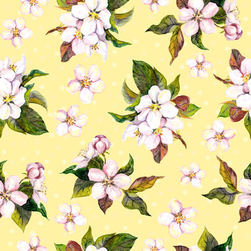 Seamless floral yellow backdrop with watercolour painted fruit flowers - apple, cherry, plum, apricot blossom 