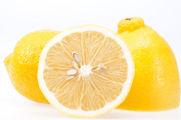 pieces of fresh yellow fruit of lemon  on white background