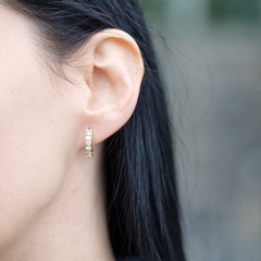 woman wearing diamond earring