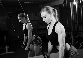 Fototapeta na wymiar Young muscular woman doing workout