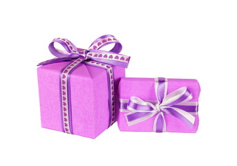 wrapped violet gift boxes with ribbon bows isolated on white