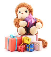 Toy monkey with a bunch of toys.