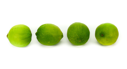Four green lemon lime isolated on white