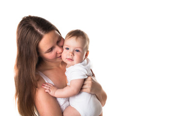 Mom gently playing with the baby in her arms