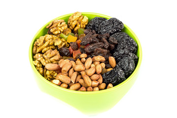 Mix nuts and dry fruits in plate isolated on white