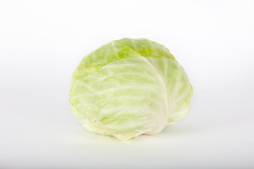 Fototapeta premium Green cabbage isolated on white-grey background