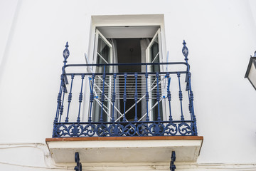 traditional Andalusian streets with flowers and white houses in