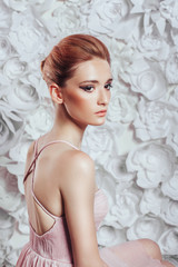 Portrait of young beautiful red-haired girl. Fashion photo