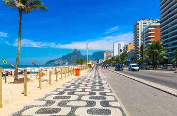 Fotobehang Ipanema beach with mosaic of sidewalk in Rio de Janeiro. Brazil © Ekaterina Belova