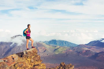 Foto op Aluminium Woman hiker in the mountains enjoying the outdoors © EpicStockMedia