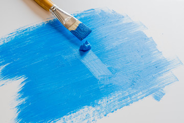 Blue acrylic paint on white foam board