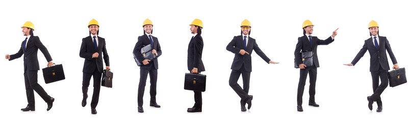 Young architect wearing hardhat on white